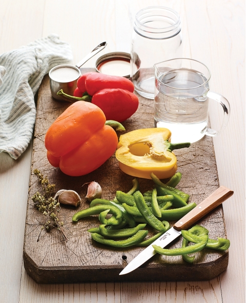 Pickling sweet peppers. Get the recipes in The Complete Guide to Pickling by Julie Laing.
